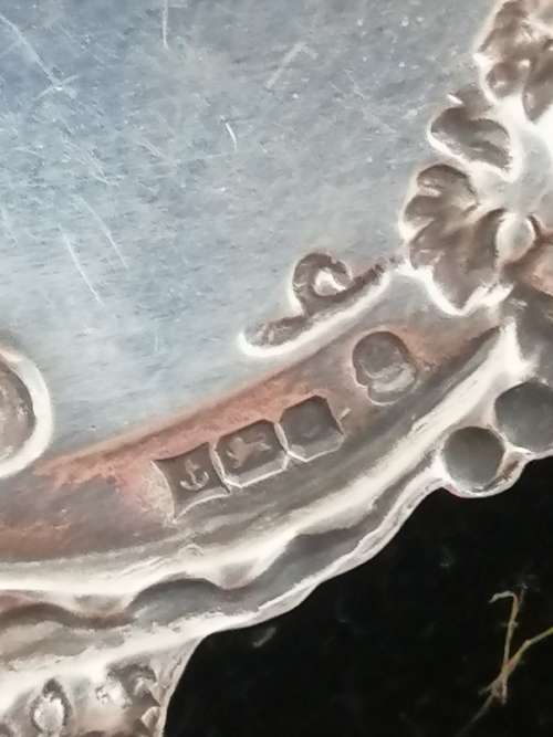 A HALLMARKED SILVER BRANDY DECANTER LABEL