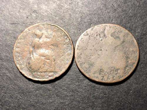 Two very old British half penny coins