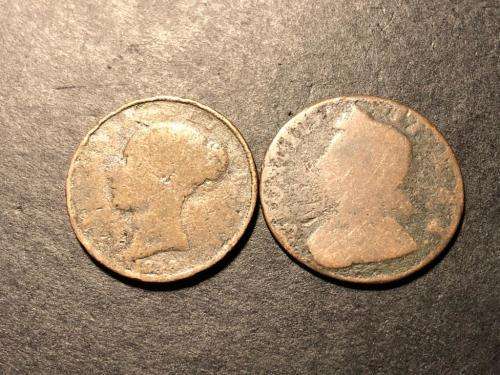 Two very old British half penny coins