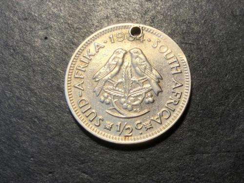 White metal (silver,nickel,etc...) plated 1964 bronze 1/2 cent coin - Holed