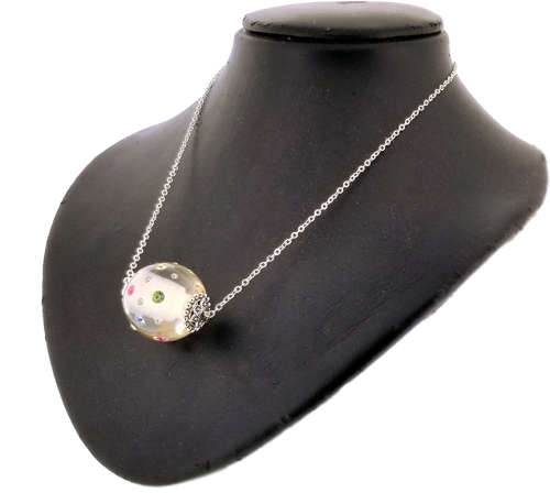 CLEAR RESIN SWAROVSKI CRYSTAL  EMBEDDED PENDANT ON SILVER CHAIN. CLEAR WITH MULTI COLOURED CRYSTALS.