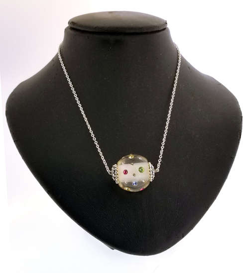 CLEAR RESIN SWAROVSKI CRYSTAL  EMBEDDED PENDANT ON SILVER CHAIN. CLEAR WITH MULTI COLOURED CRYSTALS.
