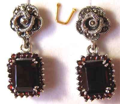 A Pair of Sterling Silver , Marcasite and Garnets Earrings.