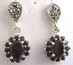 A pair of Sterling Silver, Marcasite and Garnets Earrings.