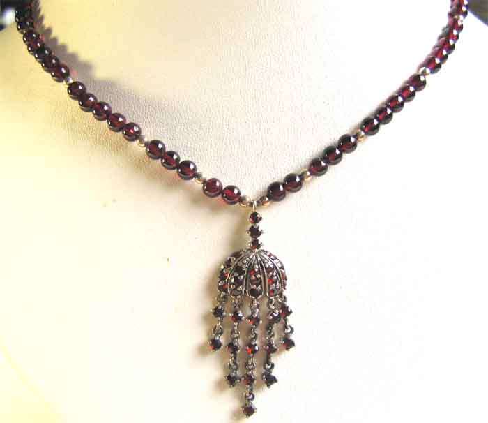 Lovely,  Silver and Garnet Drop Necklace with silver -garnets pendant.