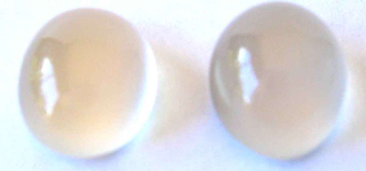 2 pieces of 6.00 x 4.00 mm oval cabachon Moonstones, T. W. 0.97 ct.