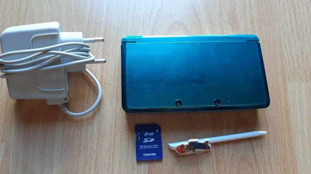 Nintendo 3ds console with original charger