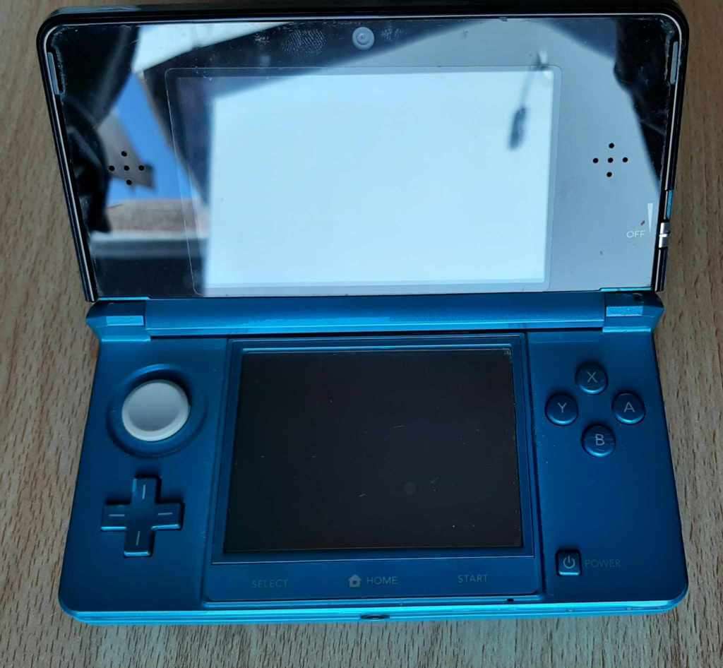 Nintendo 3ds console with original charger