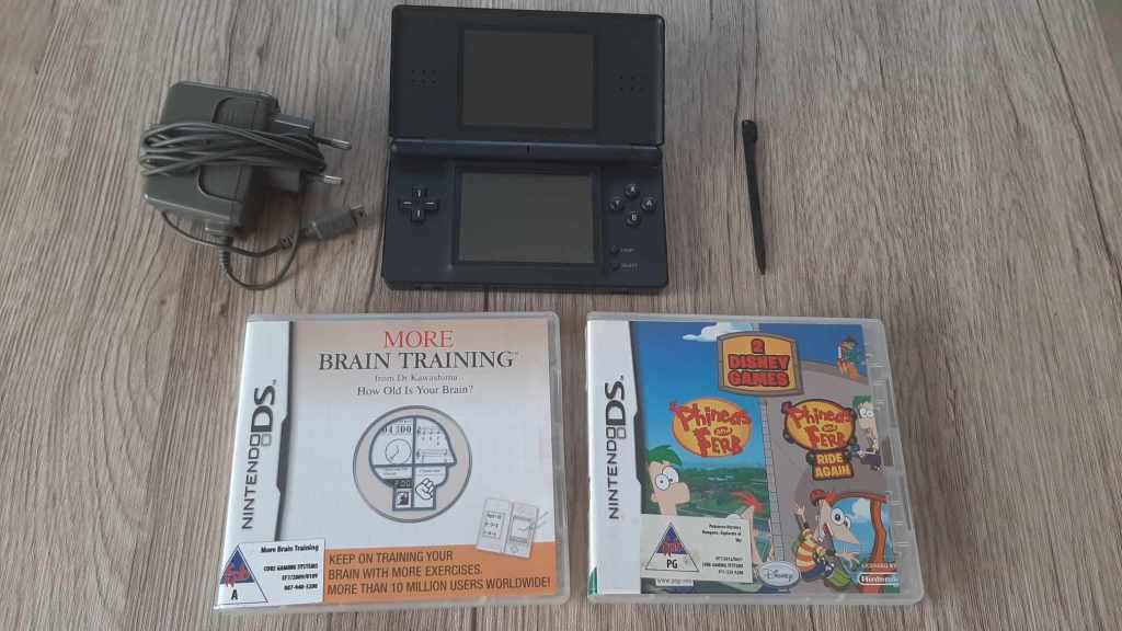Nintendo ds lite console with charger and games