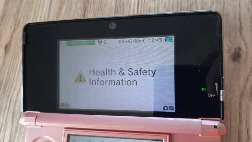 Nintendo 3ds console with original charger 3 games charging dock and case