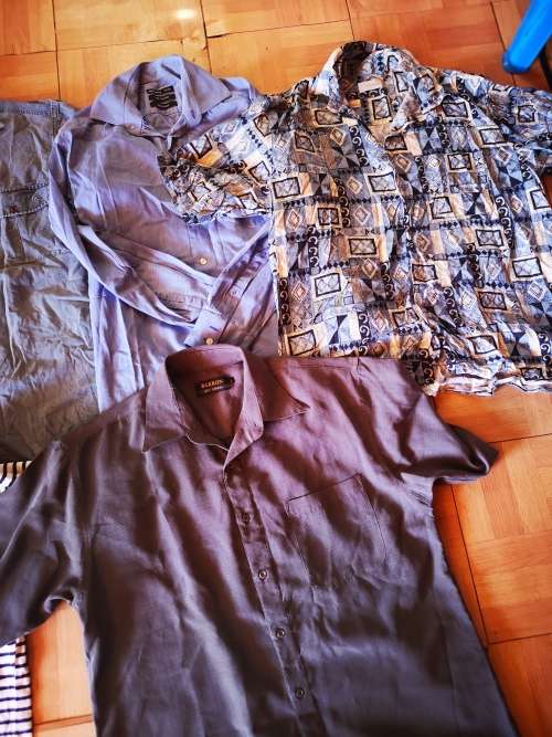 Large lot of men's clothing. Different sizes.