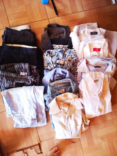 Large lot of men's clothing. Different sizes.