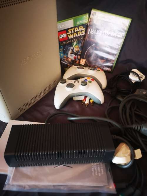 Xbox 360 (60GB) with 2 controllers, cables and 2 games