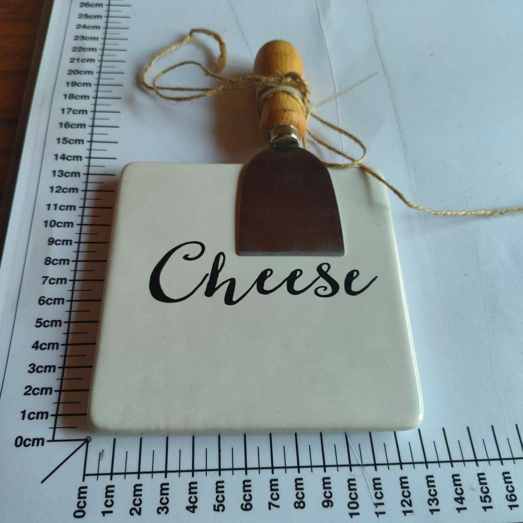Ceramic cheese board with knife