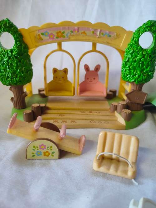 Big lot of original Sylvanian families furniture and outside playset