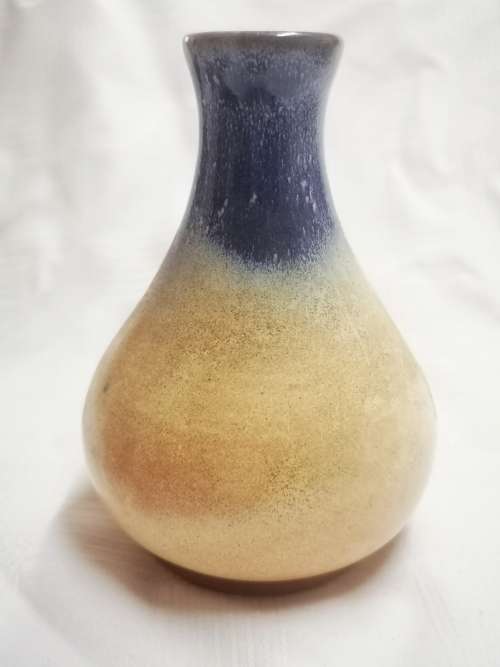 Beautiful vase with an art potteries sticker on - I don`t know who the artist is