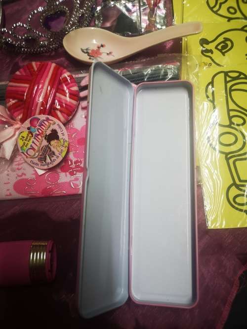 Big lot of girly goodies, includes tiaras, pink swords, pencil bag (never used) and more...