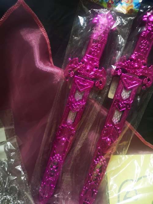 Big lot of girly goodies, includes tiaras, pink swords, pencil bag (never used) and more...