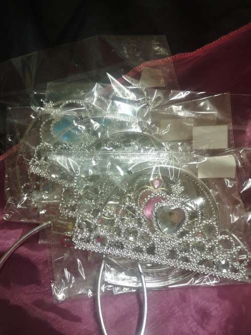 Big lot of girly goodies, includes tiaras, pink swords, pencil bag (never used) and more...