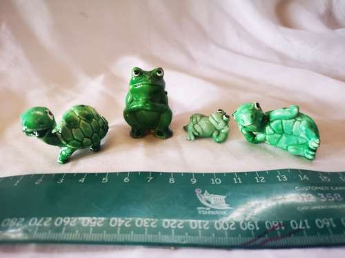 Lot of green ornaments - frogs and tortoises