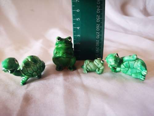 Lot of green ornaments - frogs and tortoises
