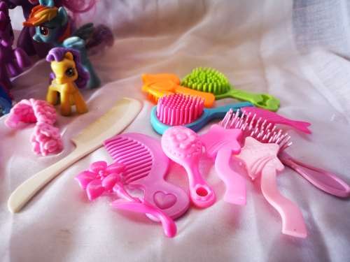 A lovely lot of genuine my little ponies and hair brushes/combs