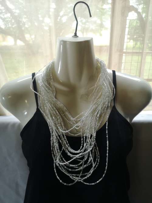 Lovely multi-strand white beaded necklace on offer.
