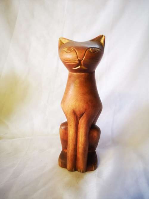 A stunning carved wood cat