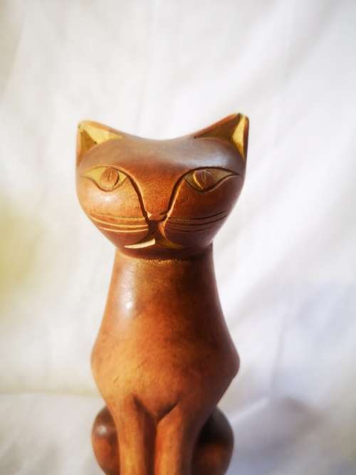 A stunning carved wood cat