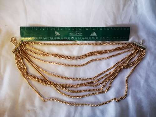 Stunning gold tone multi string necklace