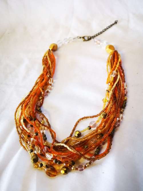 Lovely orange colored multi strand beads necklace