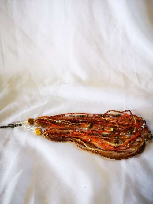 Lovely orange colored multi strand beads necklace