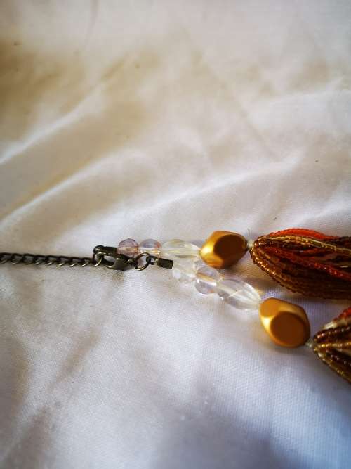 Lovely orange colored multi strand beads necklace