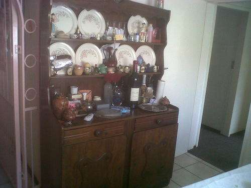 Nice old dining room buffet and round table with 3 chairs
