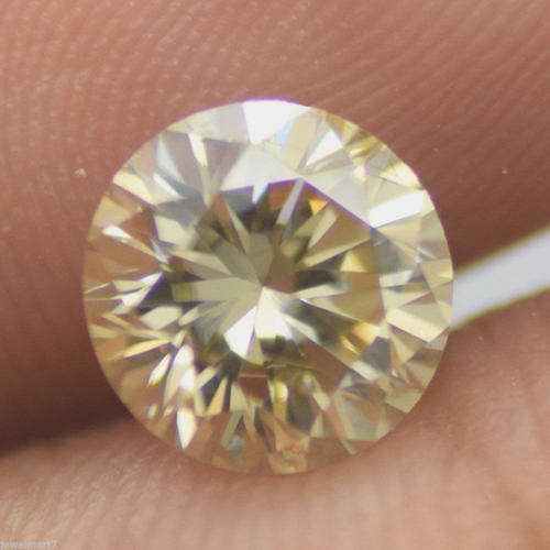 Fiery 0.69 ct 5.60 mm Fancy Yellow Round Cut Moissanite SI1