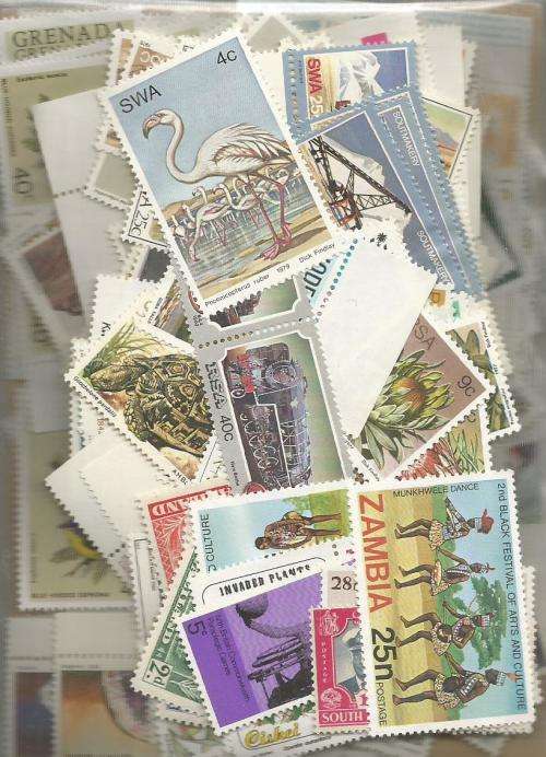MIXED WORLD  UN MOUNTED MINT   LOT IN PKT, 56.GS