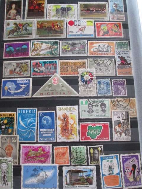 PAGE OF PREVIOUSLY HINGED STAMPS-NIGERIA/RWANDA