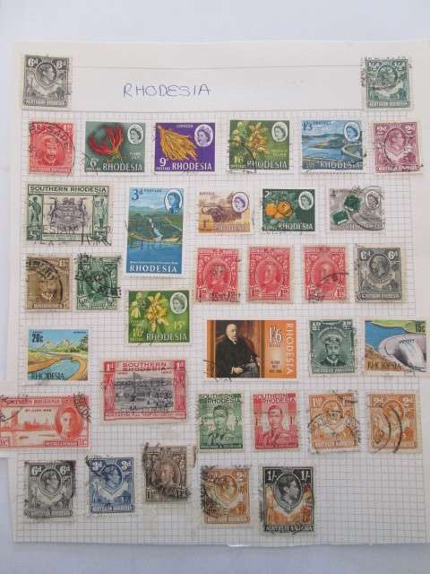 PAGE OF USED MOUNTED RHODESIA STAMPS