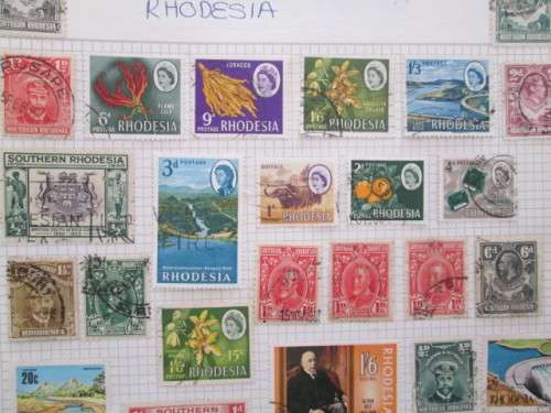 PAGE OF USED MOUNTED RHODESIA STAMPS
