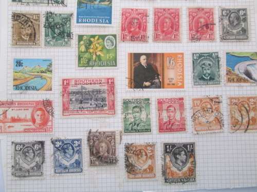 PAGE OF USED MOUNTED RHODESIA STAMPS