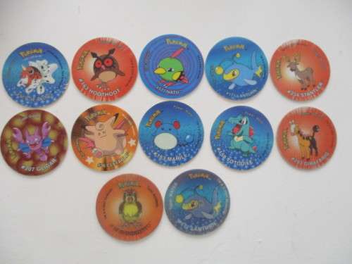 10 POKEMON TAZOS  AND 2 3D POKEMON TAZOS  - 12 PIECES