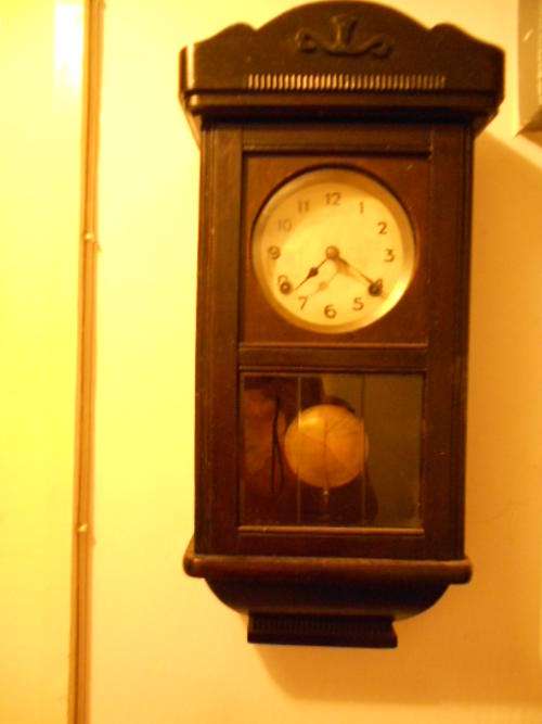 Real old wall clock lovely loud chime seviced good running order not sure of make