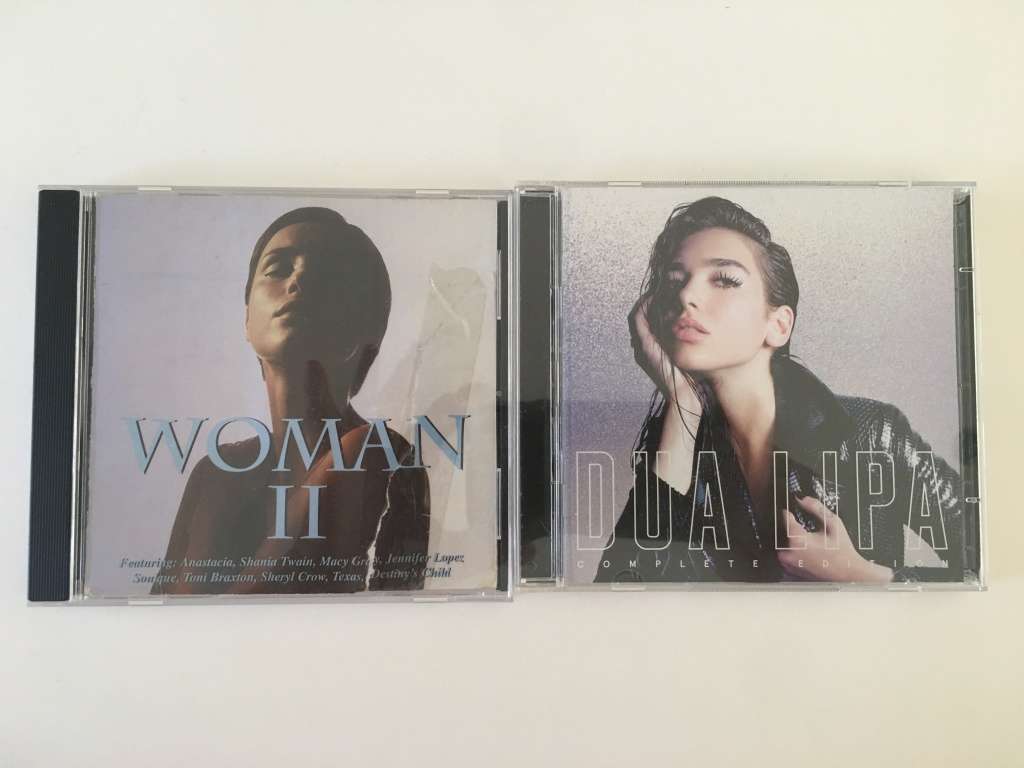 2 LOVELY MUSIC CD`S WOMAN II  AND DUA LIPA