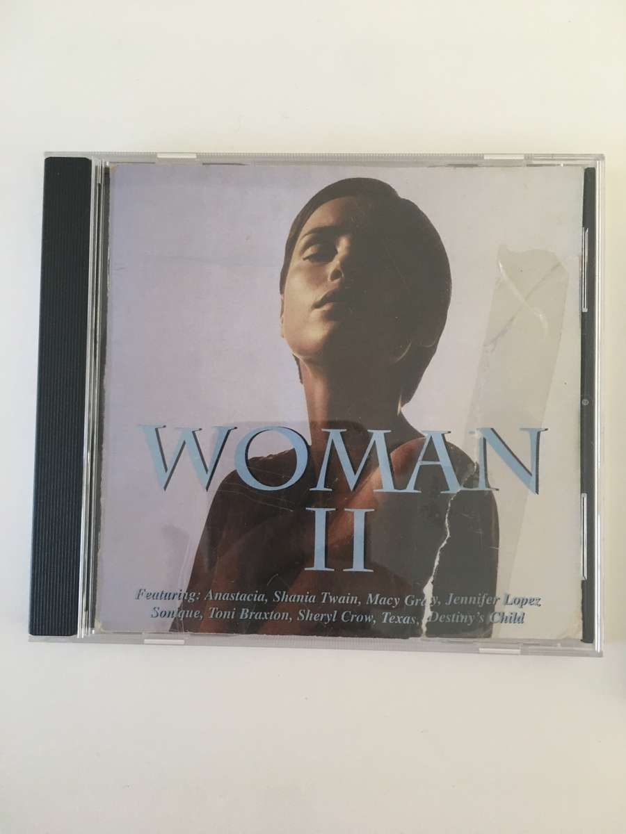 2 LOVELY MUSIC CD`S WOMAN II  AND DUA LIPA