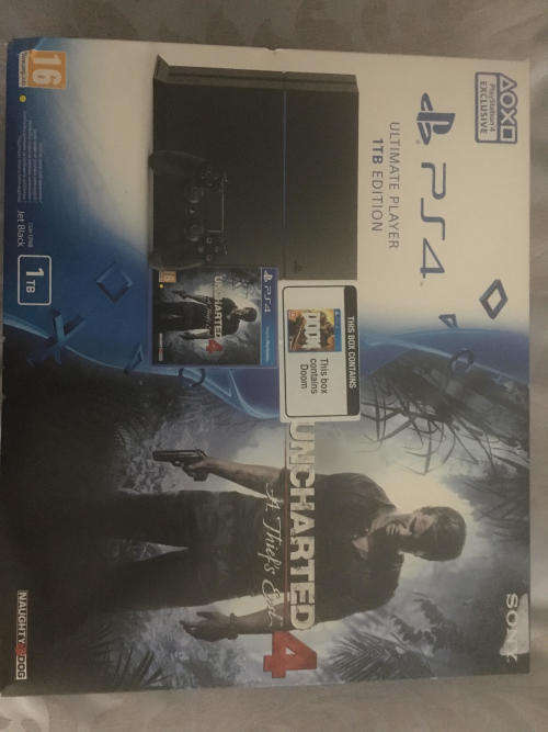 PS4 1TB with controller, Doom and Uncharted 4
