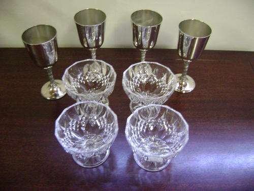 4X CRYSTAL FRUIT DISHES AND 4X SILVER PLATED WINE GOBLETS.