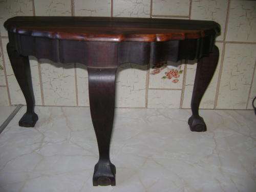 THIS HALF-MOON IMBUIA TABLE IN GOOD CONDITION