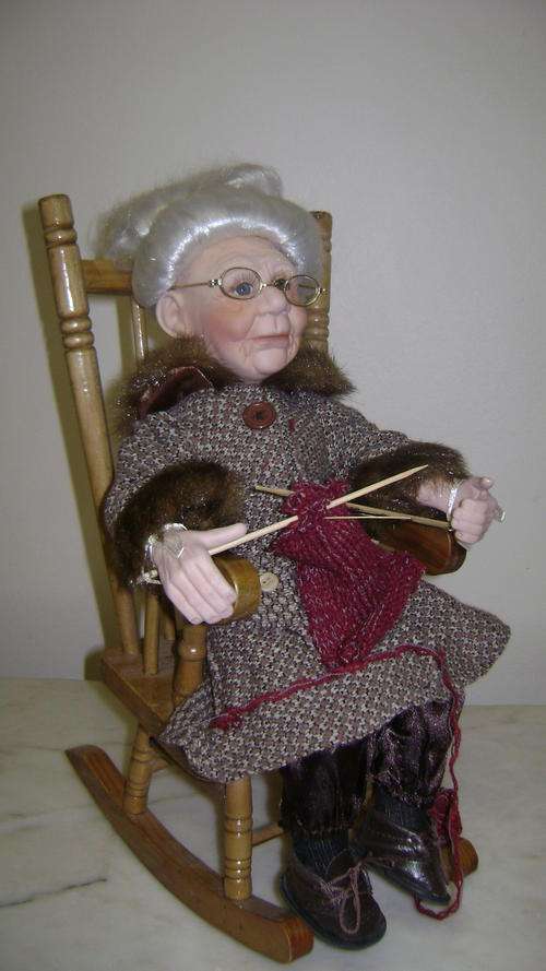 PORCELAIN GRANNY DOLL.IN ROCKING CHAIR!!!
