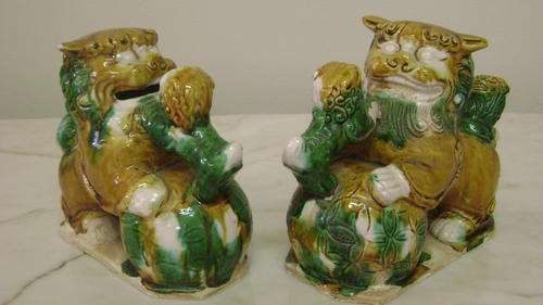 Pair of ceramic foo dogs - hand made and hand painted