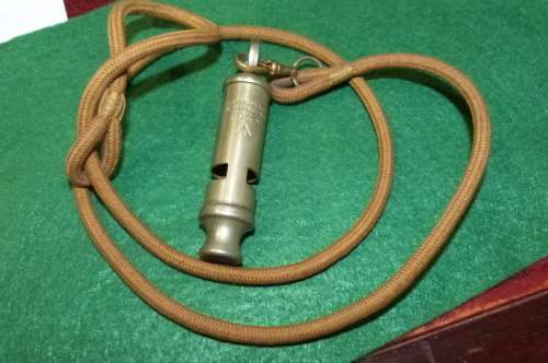 WW2 British Trench Whistle with lynyard dated 1943 and War Department mark (reduced price)